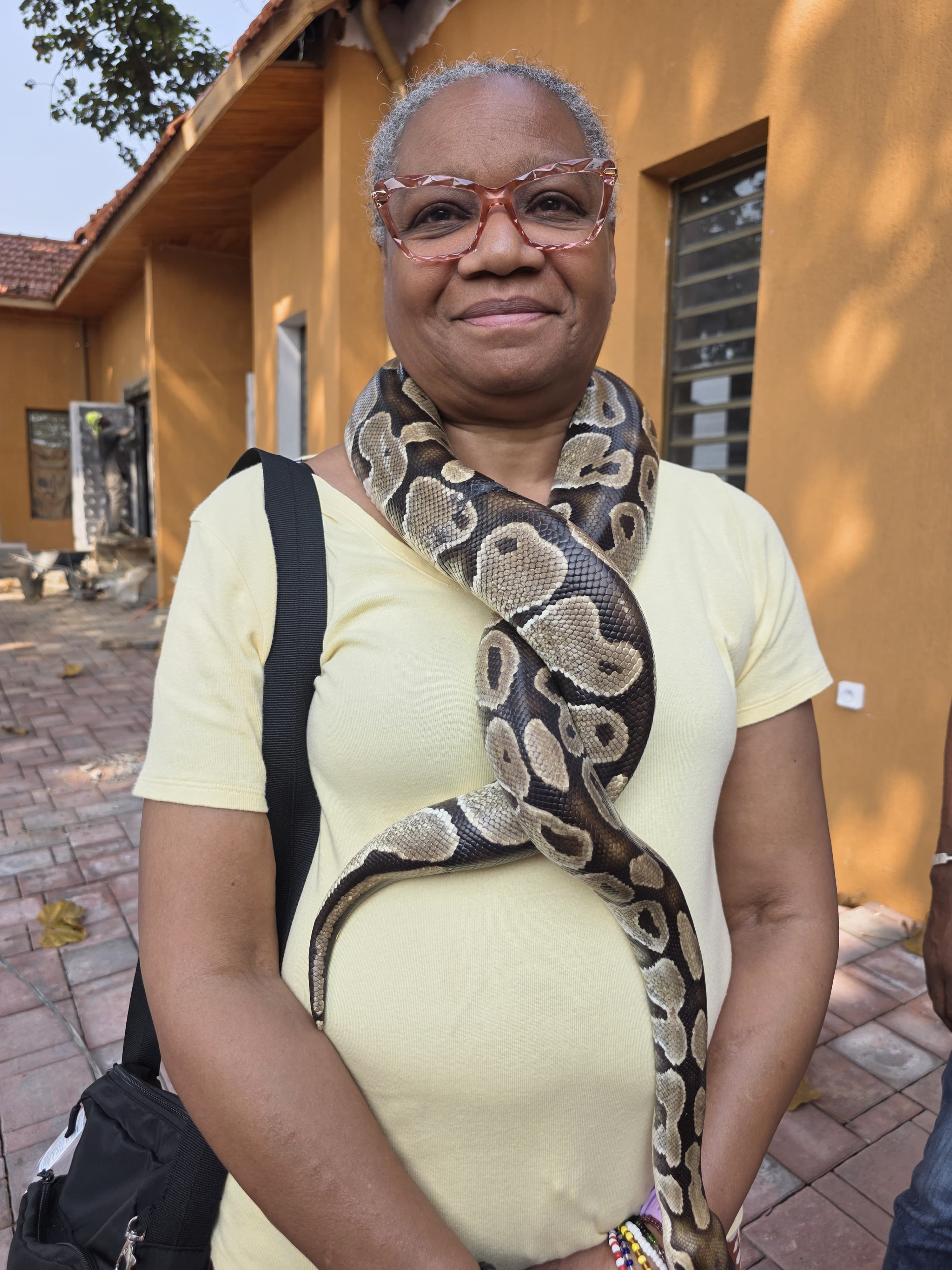 Python Temple — devotee with royal python